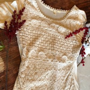 Cream colored lace blouse